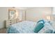 Bedroom with queen bed, white dresser, and coastal decor at 3246 Yukon Dr, Port Charlotte, FL 33948