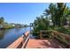Wooden dock with boat lift potential on the waterway at 3246 Yukon Dr, Port Charlotte, FL 33948