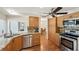 The kitchen includes wood cabinets, granite countertops, and stainless steel appliances, offering a functional cooking space at 3246 Yukon Dr, Port Charlotte, FL 33948