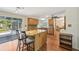 An eat-in kitchen with wood cabinets, granite countertops, stainless steel appliances, and center island at 3246 Yukon Dr, Port Charlotte, FL 33948
