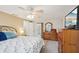 Comfortable main bedroom with carpet, ceiling fan, and ample closet space, creating a tranquil retreat at 3246 Yukon Dr, Port Charlotte, FL 33948