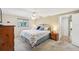 The cozy main bedroom features carpet, ceiling fan, and neutral tones, offering a relaxing ambiance at 3246 Yukon Dr, Port Charlotte, FL 33948