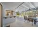Outdoor seating area overlooking screened in pool with a pass-through window to the kitchen at 3246 Yukon Dr, Port Charlotte, FL 33948