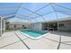 View of the pool, pool deck, and the covered patio, perfect for relaxing and entertaining at 3246 Yukon Dr, Port Charlotte, FL 33948