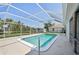 This beautiful pool with clear blue water is enclosed in a screened in lanai at 3246 Yukon Dr, Port Charlotte, FL 33948