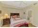 Well-lit bedroom with an adjacent bathroom featuring a walk-in shower and tub providing convenience and comfort at 3433 Grand Vista Ct # 102, Port Charlotte, FL 33953