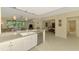 Open layout showcases the kitchen, living, and dining areas with tile flooring at 3433 Grand Vista Ct # 102, Port Charlotte, FL 33953