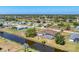 Aerial view showcasing property's waterfront location with canal views at 39 Fairway Rd, Rotonda West, FL 33947