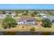 Aerial view of the house showing backyard landscaping, pool, and waterfront location at 39 Fairway Rd, Rotonda West, FL 33947