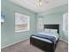 Bedroom features a large window and a comfortable bed at 39 Fairway Rd, Rotonda West, FL 33947