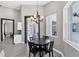 Cozy dining area with dark wood table and decorative lighting at 39 Fairway Rd, Rotonda West, FL 33947