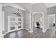 Bright foyer featuring stylish flooring, an arched entryway, and a view of the adjacent office space at 39 Fairway Rd, Rotonda West, FL 33947
