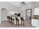 Kitchen bar with granite countertop, bar stool seating, and stainless steel appliances at 39 Fairway Rd, Rotonda West, FL 33947