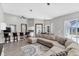 Spacious living room with vaulted ceiling, comfortable seating and breakfast bar at 39 Fairway Rd, Rotonda West, FL 33947