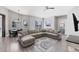 Spacious living room with vaulted ceiling, comfortable seating and lots of natural light at 39 Fairway Rd, Rotonda West, FL 33947