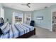 Comfortable primary bedroom features a ceiling fan, tv, and a view of the pool at 39 Fairway Rd, Rotonda West, FL 33947