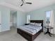 Spacious main bedroom with a tray ceiling, two windows, and an ensuite bathroom at 39 Fairway Rd, Rotonda West, FL 33947