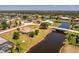 Beautiful waterfront property with lush green lawn and a picturesque view of the adjacent canal at 4 Pine Valley Ln, Rotonda West, FL 33947