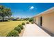 A view of the side yard and landscaping at 4 Pine Valley Ln, Rotonda West, FL 33947