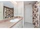 Bathroom featuring a vanity with a shower and privacy door at 4 Pine Valley Ln, Rotonda West, FL 33947