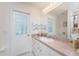 Bathroom vanity with access to the exterior lanai through glass door at 4 Pine Valley Ln, Rotonda West, FL 33947