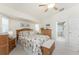 Bright bedroom with ceiling fan, dresser, and accent pillows at 4 Pine Valley Ln, Rotonda West, FL 33947
