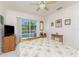 Bedroom with a ceiling fan and a view of the backyard pool at 4 Pine Valley Ln, Rotonda West, FL 33947