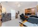 Bedroom features a wooden desk with office decor and a ceiling fan at 4 Pine Valley Ln, Rotonda West, FL 33947