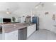 Bright kitchen features stainless steel appliances and ample counter space at 4 Pine Valley Ln, Rotonda West, FL 33947