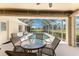 Screened lanai with a private pool and outdoor seating area at 4 Pine Valley Ln, Rotonda West, FL 33947
