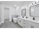 Luxury bathroom with double sinks, a freestanding tub, and a separate walk-in shower at 40 Golfview Ct, Rotonda West, FL 33947