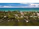 Stunning aerial view of the home near the coastline with private boat docks at 4065 N Beach Rd # A, Englewood, FL 34223