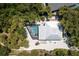 Stunning aerial view of a modern home with a private pool and lush tropical landscaping at 4065 N Beach Rd # A, Englewood, FL 34223