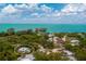 Aerial view of the home's location close to the ocean and mature landscaping at 4065 N Beach Rd # A, Englewood, FL 34223
