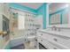 Bright bathroom features a shower/tub combo with white vanity and fixtures at 4065 N Beach Rd # A, Englewood, FL 34223