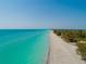 Gorgeous aerial view of the nearby white sand beach and turquoise waters at 4065 N Beach Rd # A, Englewood, FL 34223