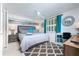 Bright bedroom with a plush bed, accent pillows, and a modern ceiling fan at 4065 N Beach Rd # A, Englewood, FL 34223