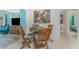 Charming dining area featuring a wooden table and chairs, with views into the living areas at 4065 N Beach Rd # A, Englewood, FL 34223