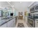 Updated kitchen features stainless appliances, granite counters, and an open layout to living spaces at 4065 N Beach Rd # A, Englewood, FL 34223