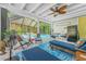 Outdoor living space featuring an outdoor fan, seating, and view into the pool at 4065 N Beach Rd # A, Englewood, FL 34223