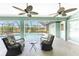The screened-in lanai features views of the pool, nice chairs and fans for comfort and convenience at 417 Rotonda Cir, Rotonda West, FL 33947