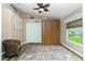 Neutral bedroom with a closet, vaulted ceiling, a decorative rug, and bright natural light at 4207 Fairway Pl, North Port, FL 34287