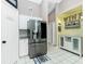 Modern kitchen featuring stainless steel appliances, custom cabinetry, and stylish serving and bar area at 4207 Fairway Pl, North Port, FL 34287