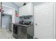 Laundry room with new appliances, extra storage, and a nearby walk-in closet offers ample space for organization and convenience at 4207 Fairway Pl, North Port, FL 34287