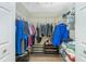 Organized walk-in closet with metal shelving, hanging rods, and ample storage space for clothes and accessories at 4207 Fairway Pl, North Port, FL 34287