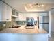 Modern kitchen featuring granite countertops, stainless steel appliances, and ample cabinet space at 4410 Warren Ave # 104, Port Charlotte, FL 33953