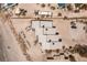 Overhead view of multi-Gathering home with roof-top windows on sandy beach, rock seawall on the left, and a dock on the sand at 5030 N Beach Rd # 1, Englewood, FL 34223