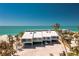 Stunning aerial view of a beachfront home featuring a modern design and beautiful ocean views at 5030 N Beach Rd # 1, Englewood, FL 34223