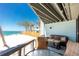 Cozy balcony seating area with views of the beach and ocean at 5030 N Beach Rd # 1, Englewood, FL 34223