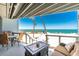 Relaxing balcony area with seating and picturesque ocean views at 5030 N Beach Rd # 1, Englewood, FL 34223